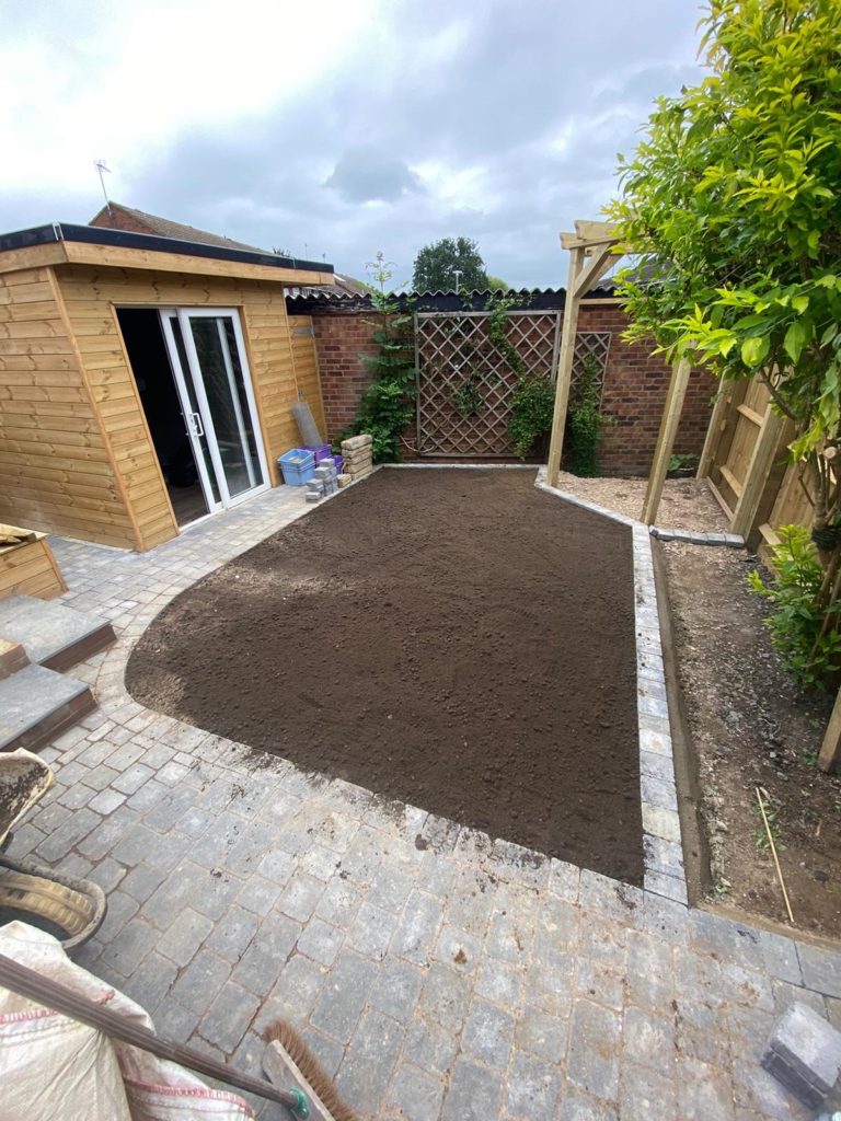 Soil level and screed with screened soil ready for turf